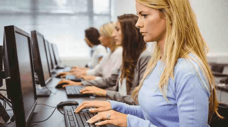 A group of pre-med students retaking the MCAT in a prometric testing center.
